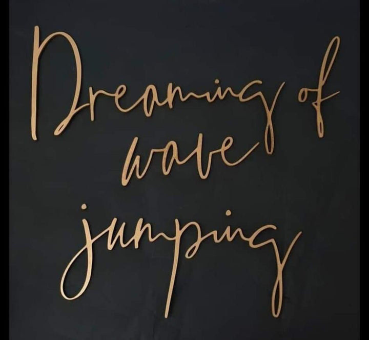 Dreaming of wave jumping, wooden wall quote